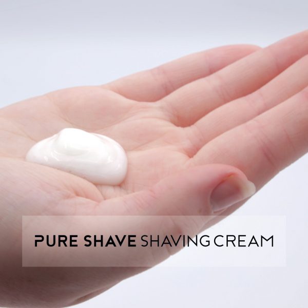 Pure Shave shaving cream in hand