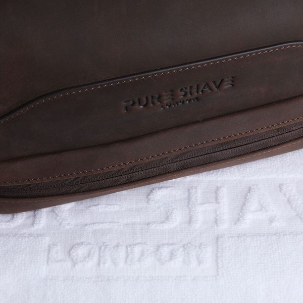 Pure shave wash bag close up with towel